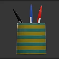 Colorful Pen Holder With Yellow And Green Stripes Containing Various Colored Pens