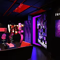 Stylish Hennessey Bar Interior With Purple Pink Lighting Sofa Seats And Bar Counter