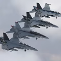 Military Fighter Jets Flying In Formation Over Cloudy Sky With Extended Landing Gears