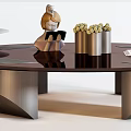 Modern Round Coffee Table With Metal Frame And Decorative Elements Like Tray And Vase