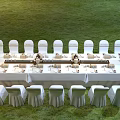 Dining Table Set With White Placemats Gold Rimmed Plates Arranged Utensils Decorative Boxes And Glassware
