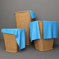 Three Woven Storage Baskets with Blue Cloth for Home Organizing and Decor