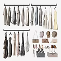 Fashionable Clothes Hanging On Racks With Accessories Like Bags Hats Shoes And Purses
