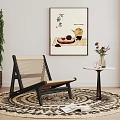 Woven Leisure Chair with Black Frame Round Rug Green Plant Wall Art and Side Table