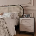 Double Bed With Rattan Headboard Brown Blanket Sunflowers Alarm Clock And Nightstand Room Decor