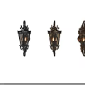 Vintage Decorative Wall Sconces With Ornate Metal Frame And Glass Shade Lit Flame Design