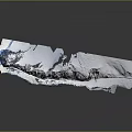 Natural Landscape of Snow Covered Island with Blue Seawater at Edges and Exposed Rocks