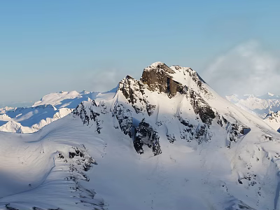 Snowy Mountain Peak With Snow Covered Slopes Rocky Outcrops Under Clear Blue Sky 3d model
