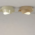 Two Cream Colored And Wooden Petal Shaped Ceiling Lights Illuminated On Gray Ceiling