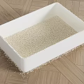 White Litter Box with Cat Litter Scattered on Wooden Floor