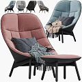 Comfortable Modern Pink Accent Chair With Quilted Backrest Blue Pillow And Fringe Blanket