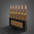 Brass Bullets Arranged In Black Magazine For Ammunition Storage