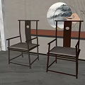 Two Chinese Leisure Chairs with Wooden Frame Light Gray Cushions and Circular Cutout Backrest Design