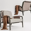 Comfortable Modern Leisure Chair With Gray Fabric Black Metal Frame And Brown Throw Blanket