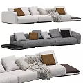 Multi Seater Sofa With Grey White Upholstery Brown Grey Pillows Knit Blanket And Side Table