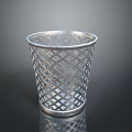 Silver Metal Trash Can With Diamond Lattice Design On Black Surface And Reflection