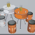 Barrel Shaped Chairs With Black Seats And Round Tables With Metal Legs In Orange White