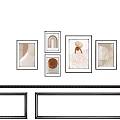 Minimalist Wall Art Display With Framed Paintings And Soft Tones