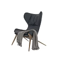 Comfortable Black Leather Leisure Chair With Wooden Legs And Gray Throw Blanket