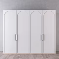 White Dresser With Arched Doors And Metal Handles Against Gray Wall