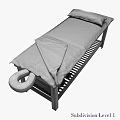 Massage Bed with Black Frame Gray Beige Blanket Pillows and Lower Shelf Stacked Towels