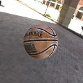Spalding NBA Official Basketball With Brown Leather Surface And Black Stripes On Outdoor Brick Pavement