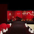 Elegant Banquet Hall With Red Floral Decorations And Wedding Stage Setup