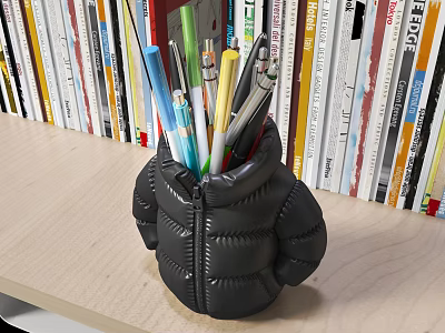 Colorful Writing Pens Stored in Black Puffer Jacket Shaped Holder on Desk with Books 3d model
