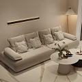 Modern Beige Sofa And Coffee Table Set With Throw Pillows Floor Lamp And Decorative Items