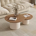 Beige Sofa With Two Round Coffee Tables Wooden Tabletop White Cylindrical Base And Magazines