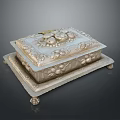 Decorative Metallic Household Item With Carved Floral Patterns And Footed Base