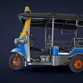 Three Wheeled TukTuk Taxi With Blue Yellow Body And Top Taxi Sign