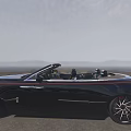 Black Open Top Luxury Car With Red Accented Wheels And Chrome Grille On Scenic Road