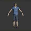 Man In Blue T Shirt And Blue Shorts Standing Against Gray Background