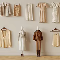 Trendy Beige White And Brown Fashion Outfits On Mannequins Hangers Against Neutral Wall