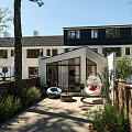 Modern Garden Landscape with Hanging Chair Sofa Stone Wall and Green Plants in Patio
