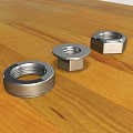 Stainless Steel Hardware Nuts Various Types On Wooden Tabletop