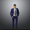 Man in Blue Suit White Shirt Red Tie with Hands in Pockets on Gray Background