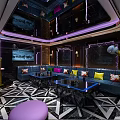 Modern KTV Interior With Colorful Sofas Microphones TV Screens Marble Coffee Tables And Lighting