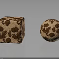 Textured Cube And Sphere With Brown Spots On Light Brown Surface