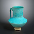 Blue Ceramic Vase Sculpture With Intricate Carved Patterns Handle And Light Colored Base