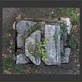 Stone Garden Structure With Stacked Stones Green Plants Grass And Soil