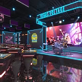 Modern Jeans Lounge Bar With Live Band Stage Purple Blue Lighting And Tables