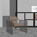 Modern Leisure Chair With Beige Cushion And Metal Frame By Bookshelf In Interior