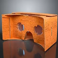 Orange Handmade Cardboard VR Headset With Folded Structure And Lens Holes