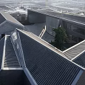 Modern Sales Office Building With Unique Curved Design And Wooden Roof Structure