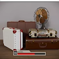 Vintage Suitcases Stacked Brown White Patterned With Retro Fan On Top