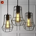 Industrial Style Pendant Lights With Black Metal Frames And Yellow Bulbs On White Wall