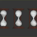 Three Wooden Hourglasses With Sand On Black Surface And Clear Reflections