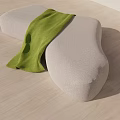 Abstract Shape Gray Fabric Sofa With Green Throw Blanket On Wooden Floor